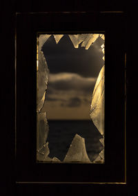 Close-up of broken glass window
