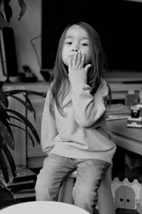 Cute girl sitting at home