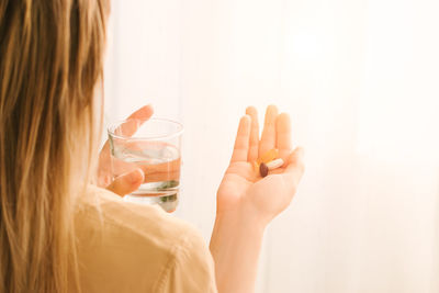 Close-up portrait of woman holding hands