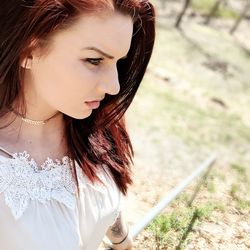 Close-up of young woman looking away