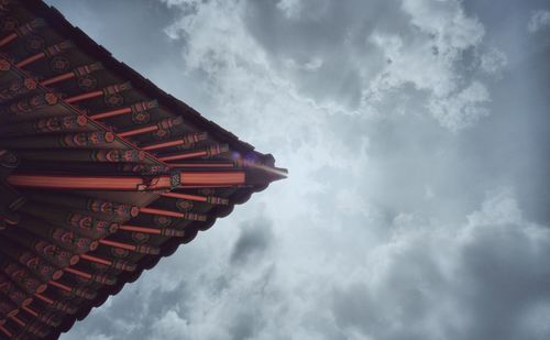 Low angle view of traditional building roof against sky