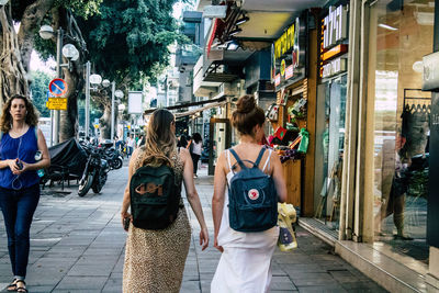 People walking on street in city