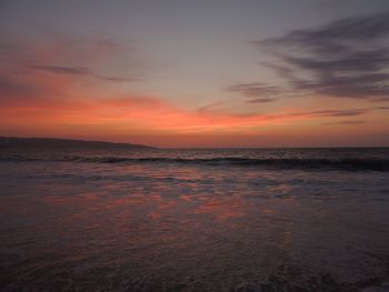 Scenic view of sea against sky at sunset