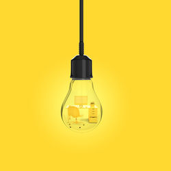 Close-up of light bulb against yellow background