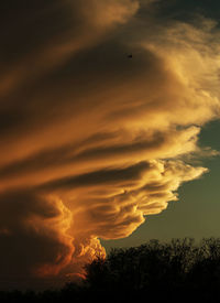 Scenic view of dramatic sky at sunset
