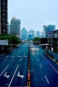 City street and modern buildings against sky