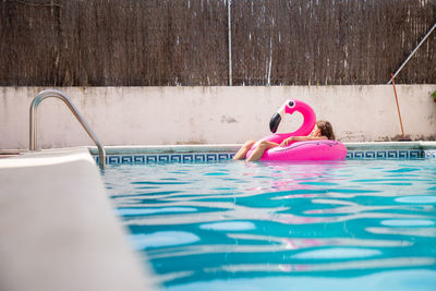 Woman swimming in pool