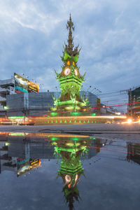 Reflection of illuminated building in water