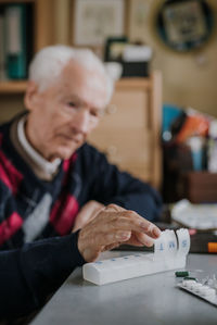 Portrait of man working on table