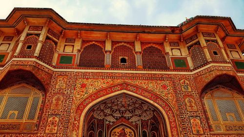 Low angle view of ornate building against sky