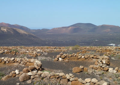 Scenic view of rocky mountains against clear sky