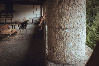 People standing by wall of building