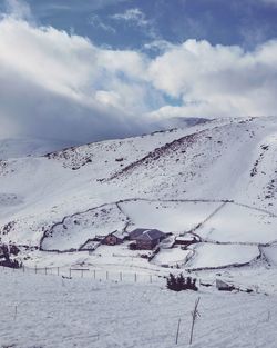 Scenic view of snow covered landscape against sky