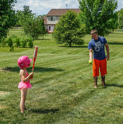 Full length of girl standing on grassy field