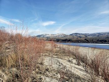 Scenic view of snowcapped mountains against sky