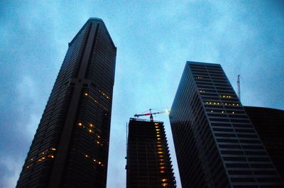 Low angle view of skyscrapers against clear sky