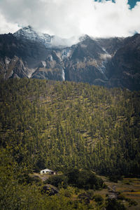 High angle view of trees and mountains against sky