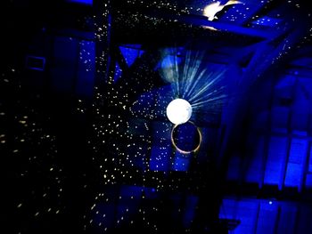 Low angle view of illuminated ceiling