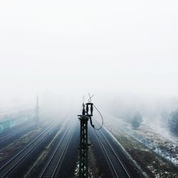 Railroad tracks during foggy weather