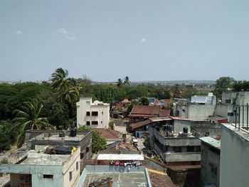 Houses in town against clear sky