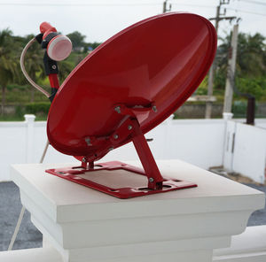 Close-up side view of red boat on table