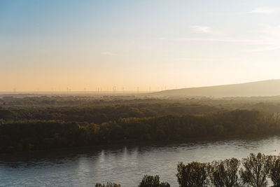 Scenic view of lake against sky during sunset