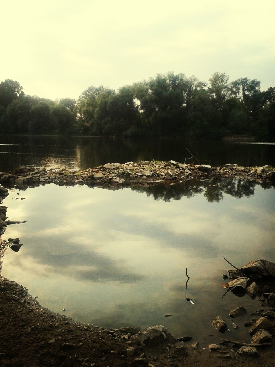 water, reflection, tranquil scene, tranquility, lake, scenics, tree, sky, beauty in nature, nature, standing water, idyllic, calm, non-urban scene, lakeshore, outdoors, day, cloud - sky, rock - object, no people