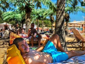 Portrait of man relaxing at beach