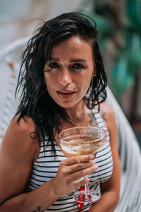 Portrait of woman drinking glass