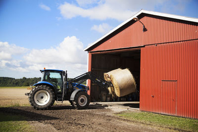 Tractor on field against sky