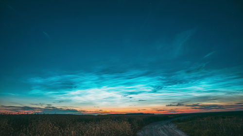 Scenic view of landscape against sky at night