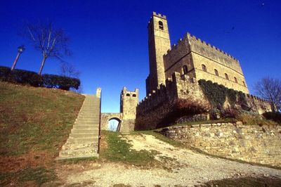 Low angle view of built structure against clear blue sky