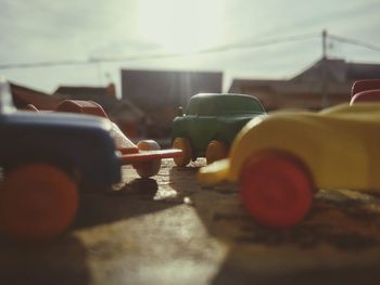 Close-up of hand holding car on street