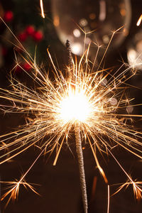 Low angle view of firework display at night