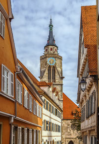 Low angle view of buildings in city against sky