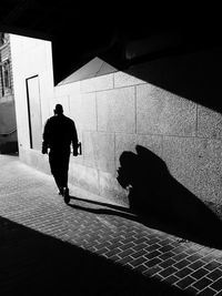 Shadow of woman on wall