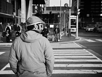 Woman standing on city street