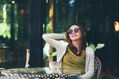 Portrait of woman wearing sunglasses