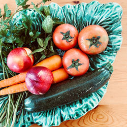 High angle view of fruits in basket on table