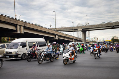 People riding motorcycle on street
