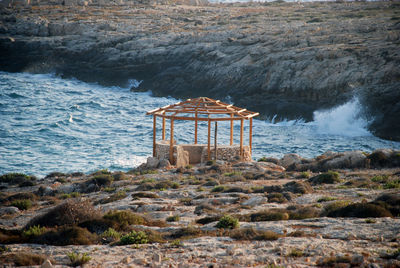 Lifeguard hut on rocks by sea