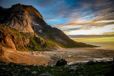 Scenic view of beach against sky during sunset