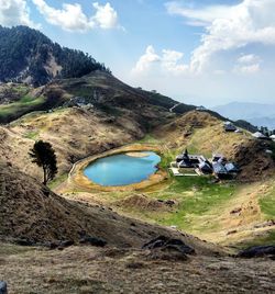 Scenic view of mountain against cloudy sky