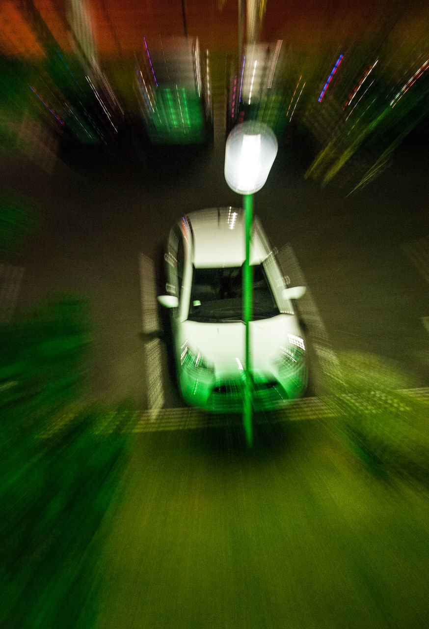 DEFOCUSED IMAGE OF ILLUMINATED LIGHTS ON GLASS