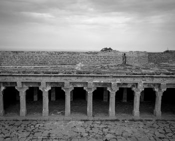 View of old ruin building against cloudy sky