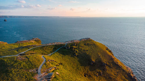 Scenic view of dramatic cliff at golden hour