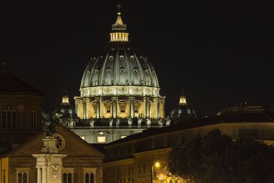 Illuminated cathedral against sky at night