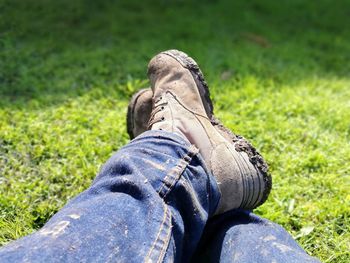 Low section of man sitting on field