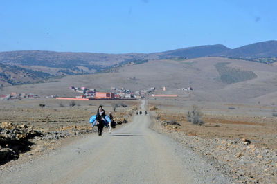 Man riding motorcycle on road