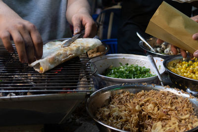 Midsection of person preparing food